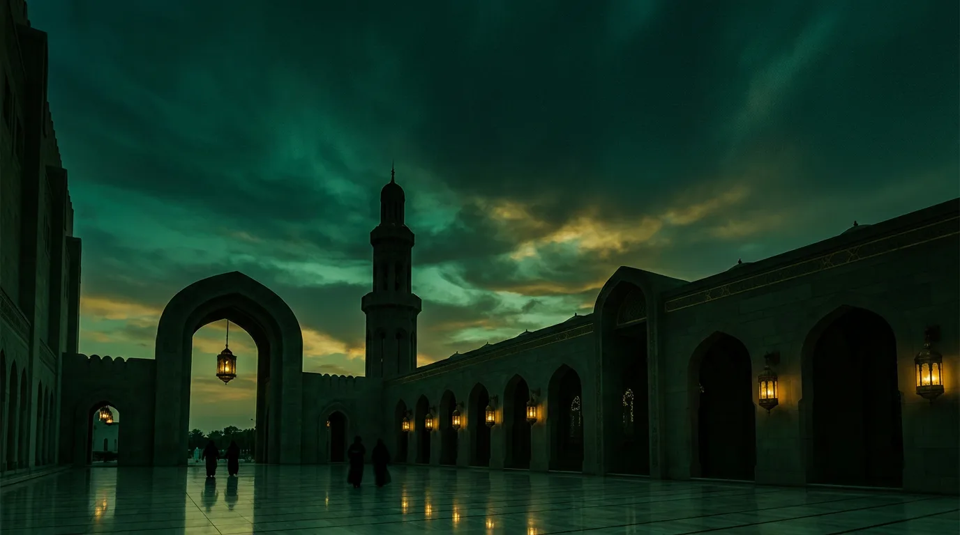 Mosque courtyard at dusk with lanterns lit along the arcades